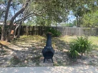 a water fountain in the middle of a yard