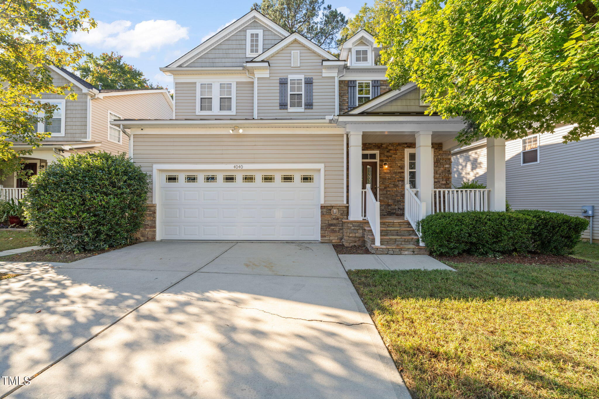 4040 Wester Road Raleigh, NC 27604 - Photo 1 of 35 a front view of a house with a yard and garage