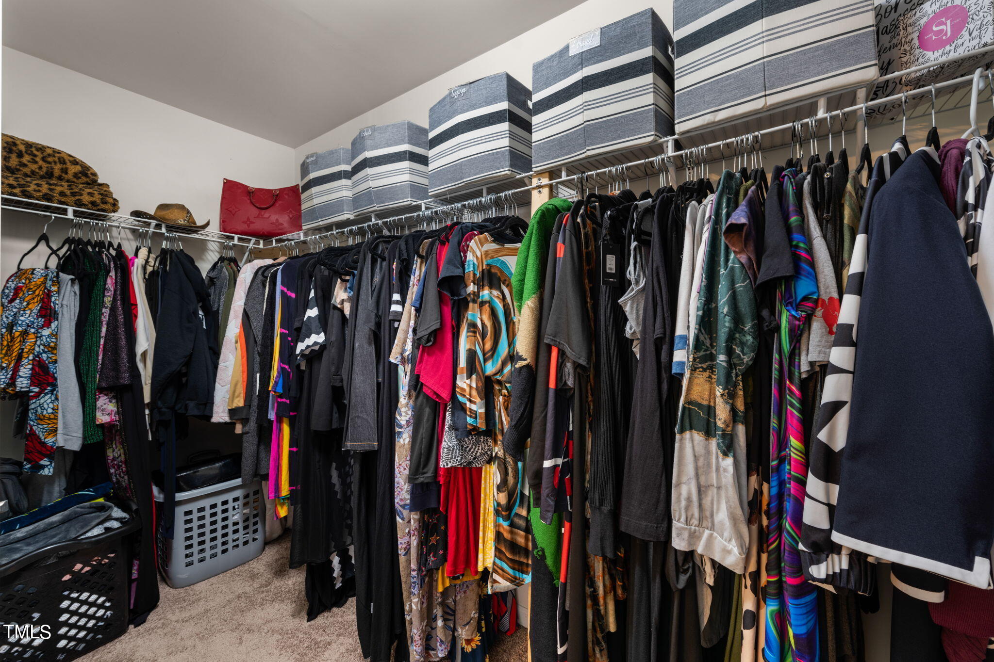 4040 Wester Road Raleigh, NC 27604 - Photo 19 of 35 a view of walk in closet with clothes