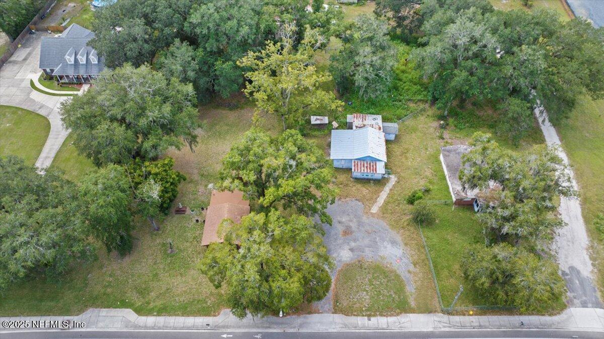 9044 Crystal Springs Road Jacksonville, FL 32221 - Photo 2 of 9 an aerial view of a house with a yard basket ball court and outdoor seating