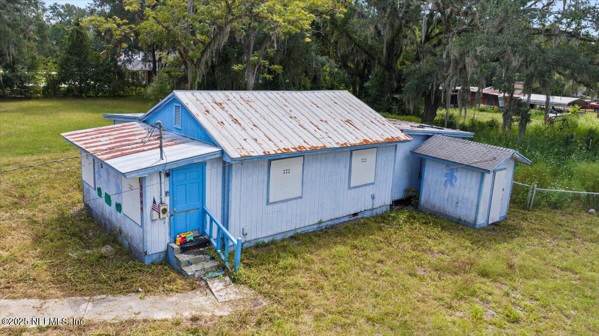 9044 Crystal Springs Road Jacksonville, FL 32221 - Photo 9 of 9 front view of a house with a yard