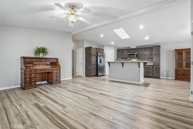 a view of kitchen with cabinets and wooden floor