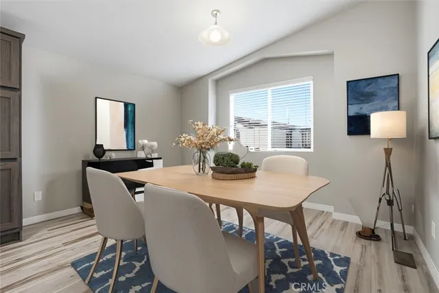 a dining room with furniture and window