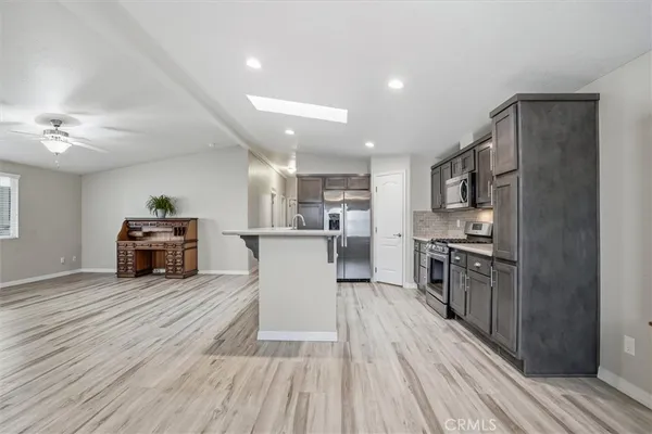 a kitchen with a cabinets and a wooden floor