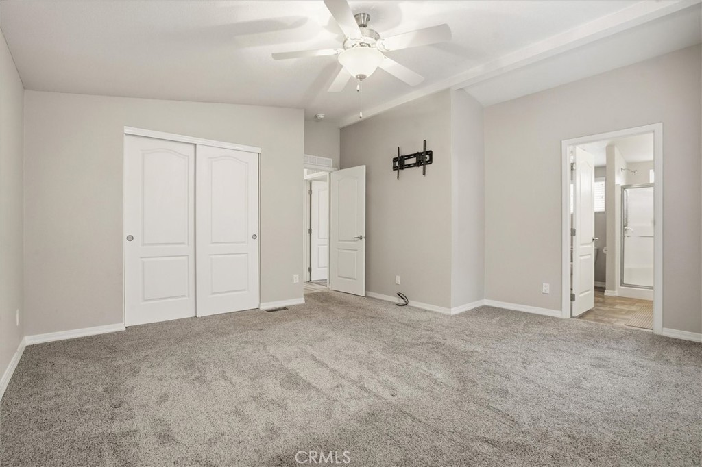 500 Atascadero Road Morro Bay, CA 93442 - Photo 24 of 43 an empty room with closet and a ceiling fan