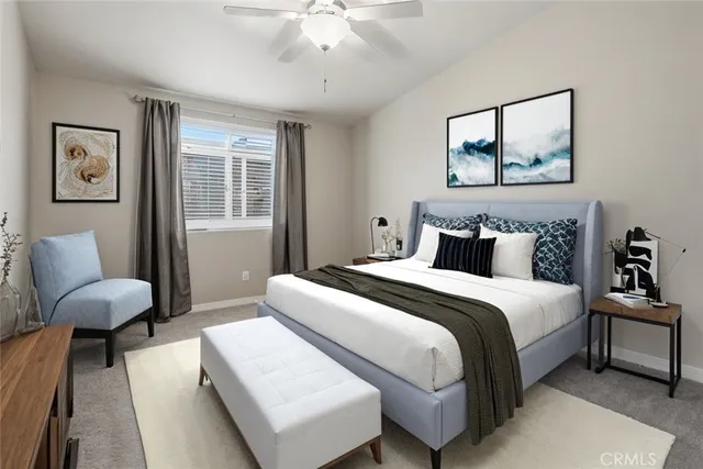 a bedroom with bed and a couch