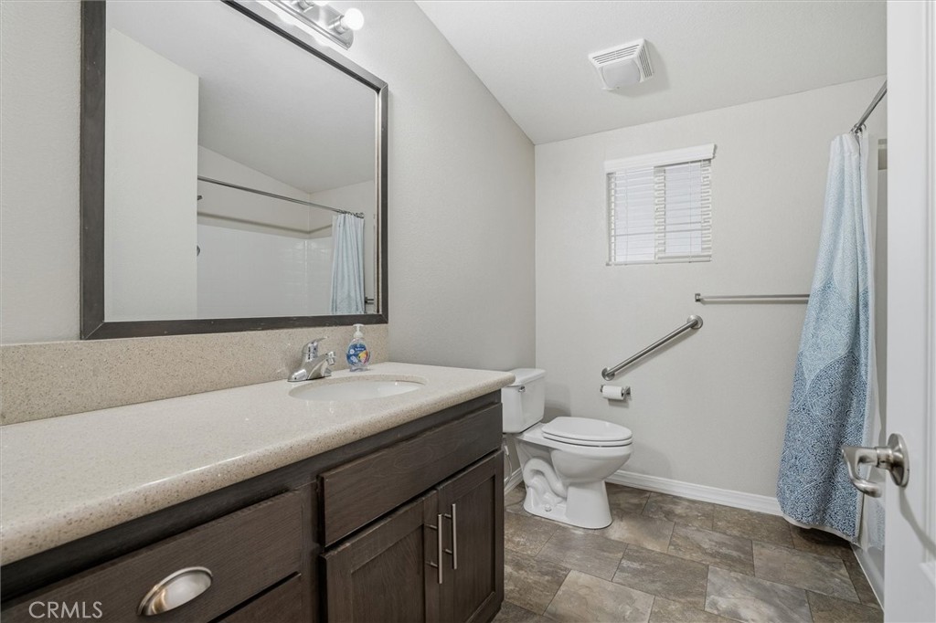 500 Atascadero Road Morro Bay, CA 93442 - Photo 30 of 43 a bathroom with a sink a toilet and mirror