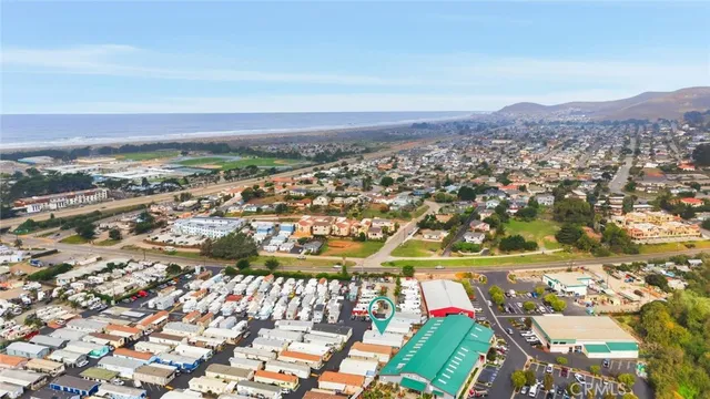 an aerial view of residential building and car parked