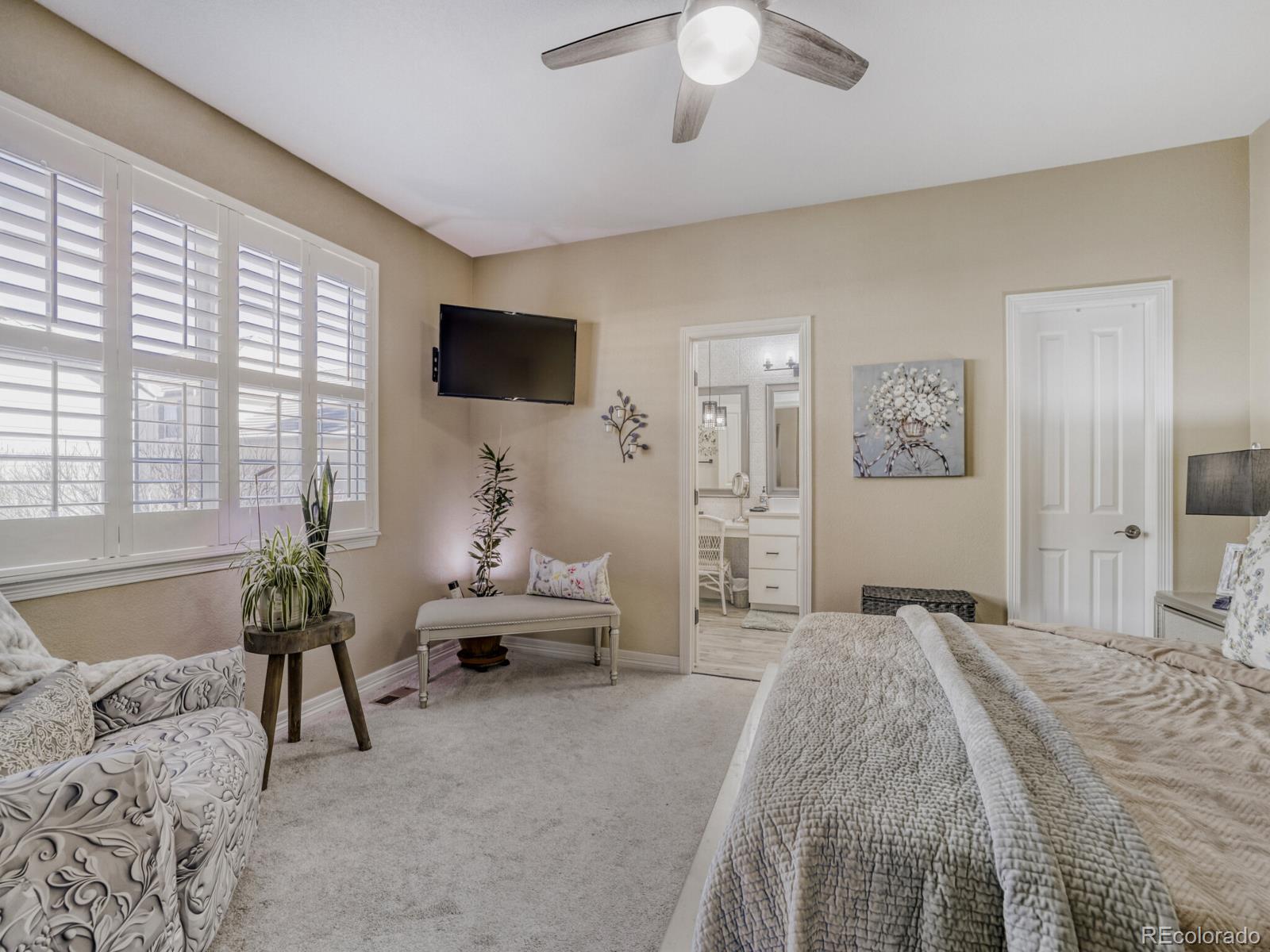 8893 Tappy Toorie Circle Highlands Ranch, CO 80129 - Photo 11 of 36 a bedroom with a bed and a couch