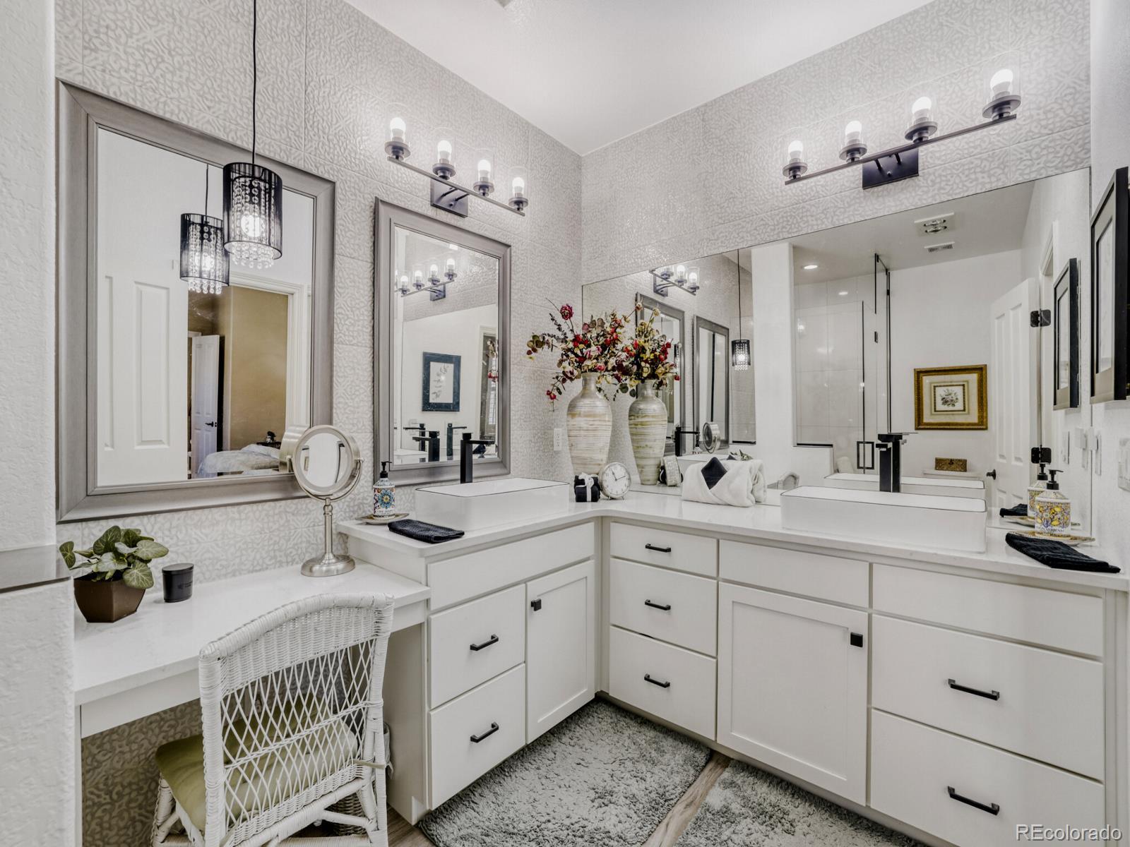 8893 Tappy Toorie Circle Highlands Ranch, CO 80129 - Photo 14 of 36 a spacious bathroom with double sink and a mirror