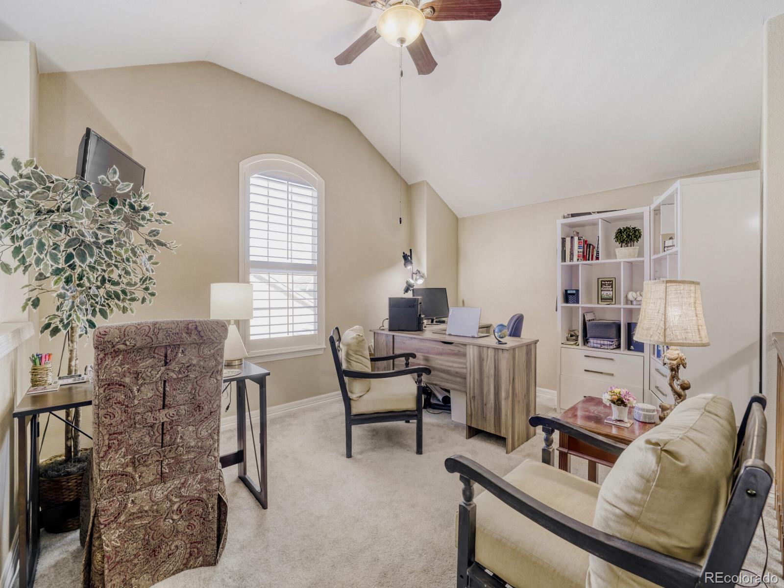 8893 Tappy Toorie Circle Highlands Ranch, CO 80129 - Photo 18 of 36 a living room with furniture and a window