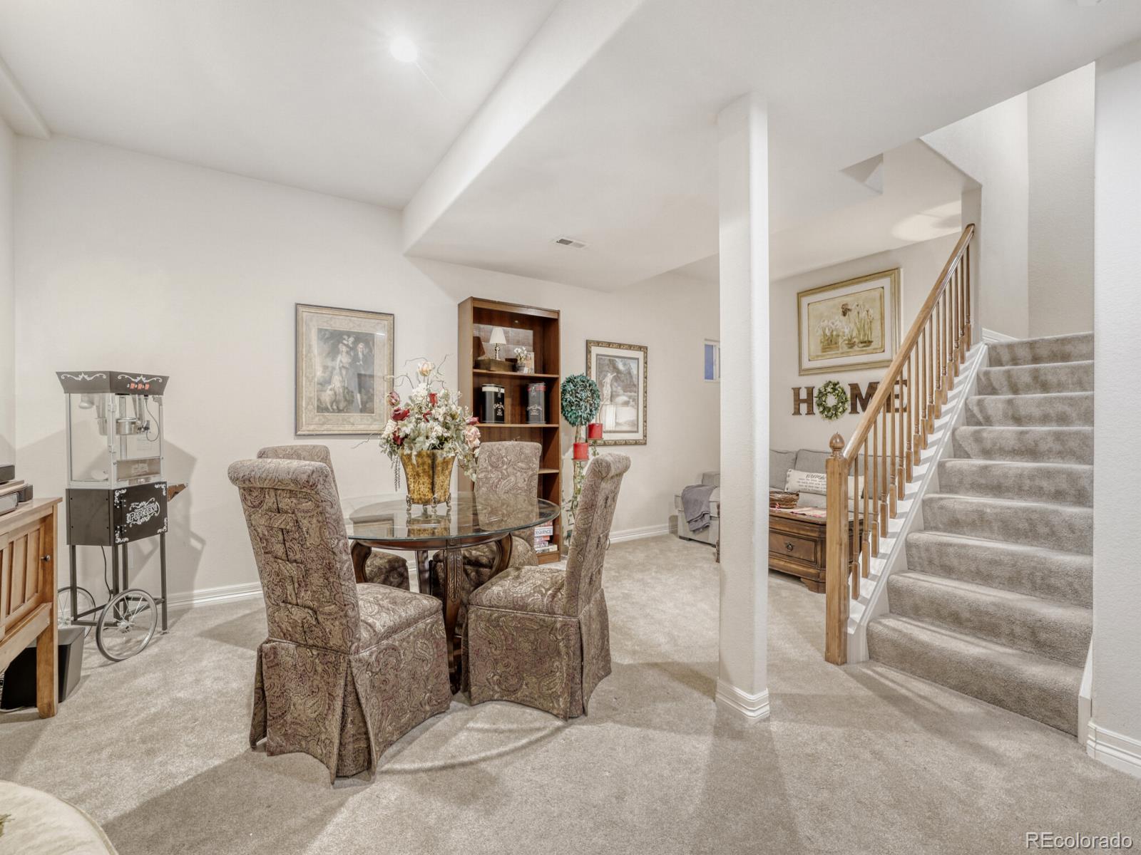 8893 Tappy Toorie Circle Highlands Ranch, CO 80129 - Photo 20 of 36 a view of a dining room with furniture