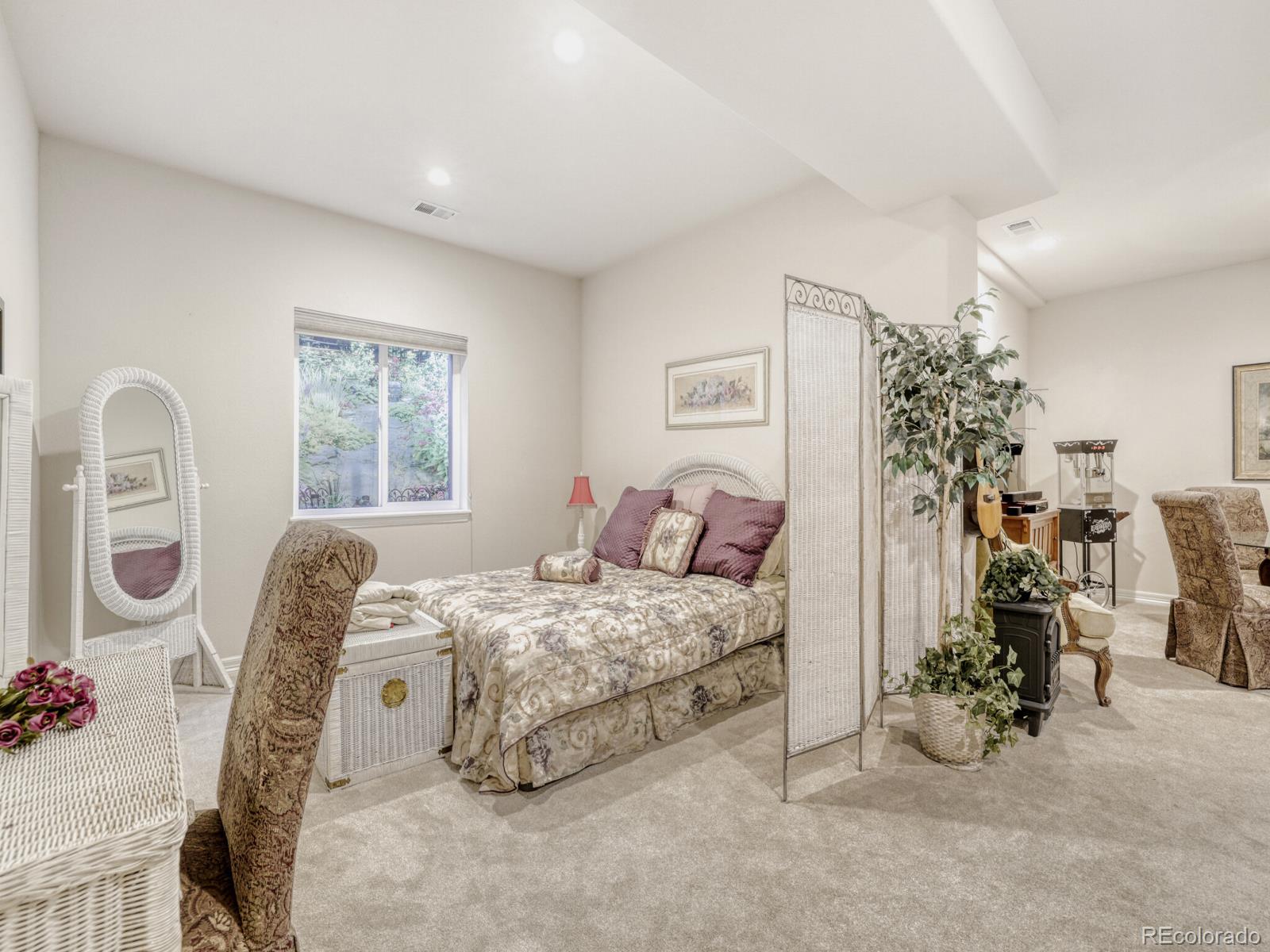 8893 Tappy Toorie Circle Highlands Ranch, CO 80129 - Photo 21 of 36 a bedroom with bed and a window