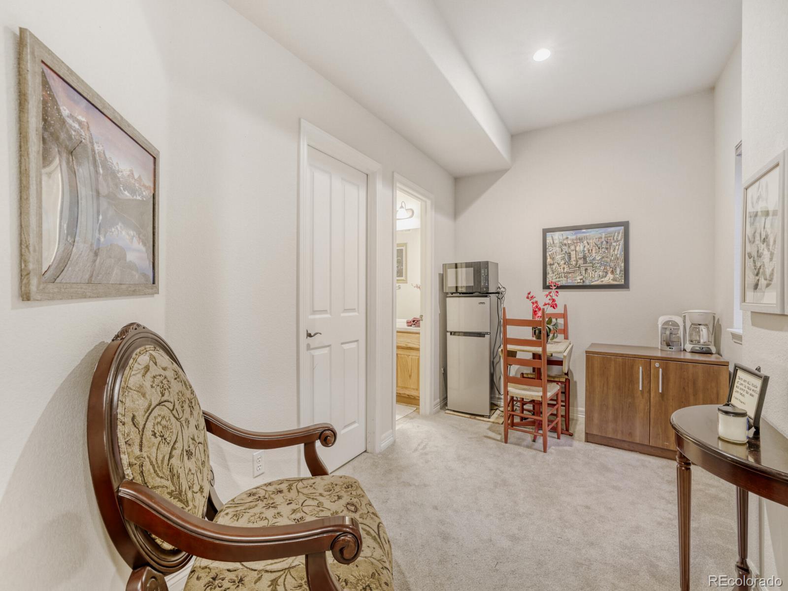 8893 Tappy Toorie Circle Highlands Ranch, CO 80129 - Photo 22 of 36 a view of a room with furniture and windows