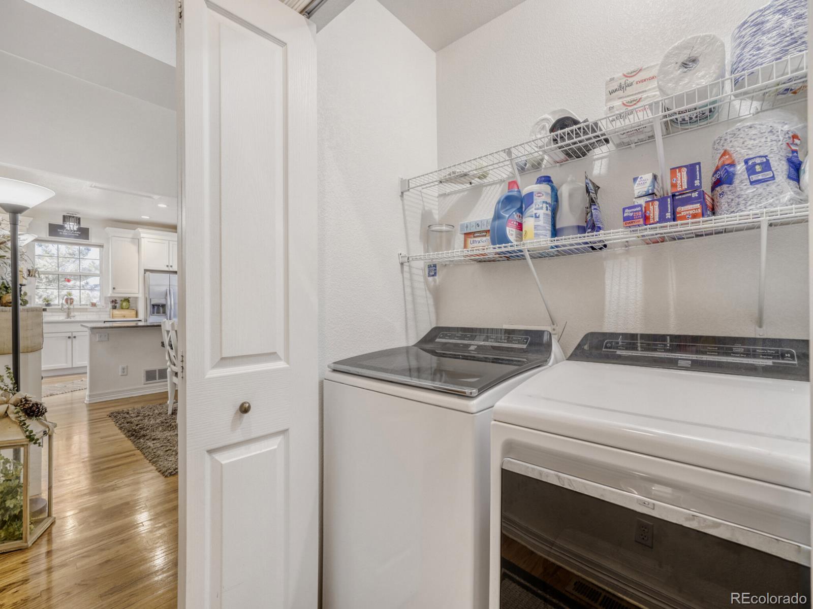 8893 Tappy Toorie Circle Highlands Ranch, CO 80129 - Photo 24 of 36 a utility room with dryer and washer