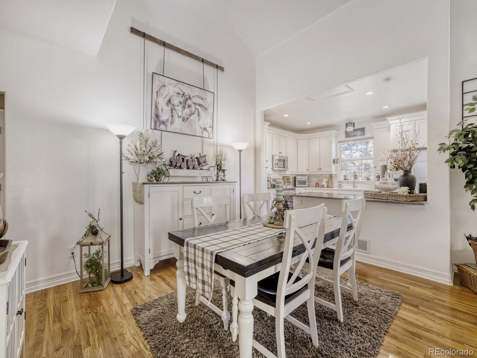 8893 Tappy Toorie Circle Highlands Ranch, CO 80129 - Photo 7 of 36 a view of a dining room with furniture