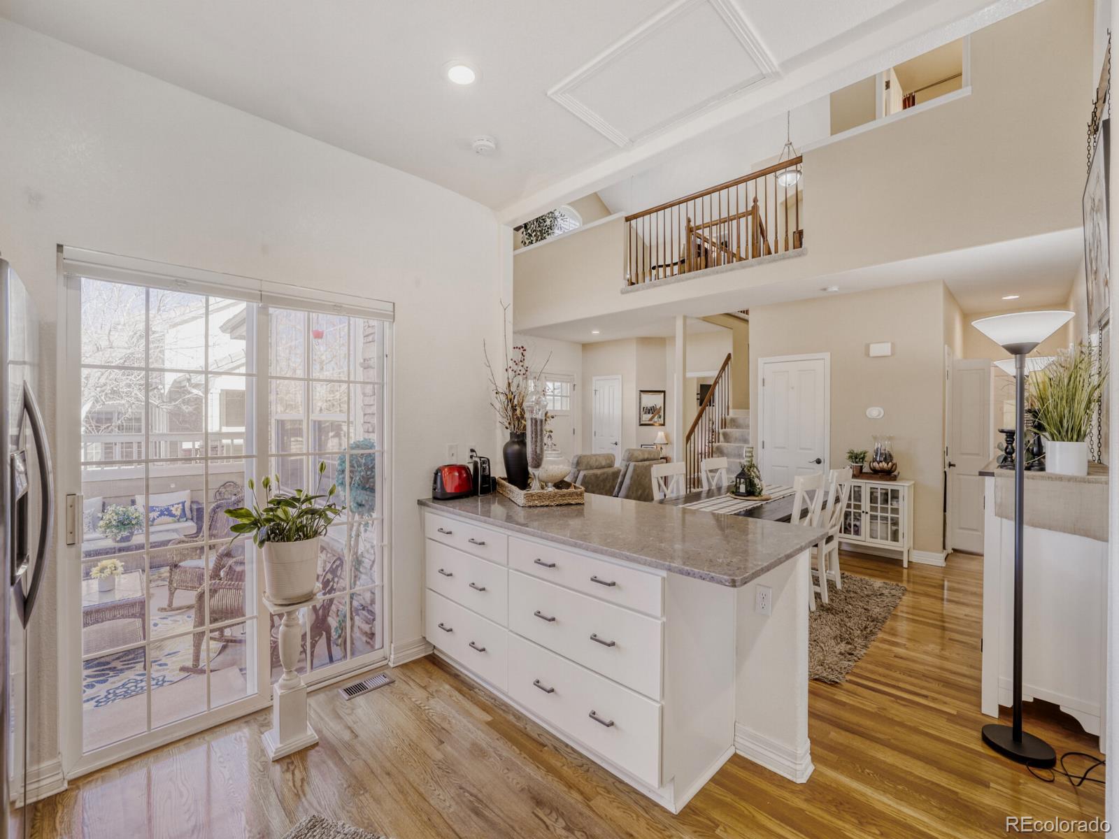8893 Tappy Toorie Circle Highlands Ranch, CO 80129 - Photo 10 of 36 a living room with furniture and wooden floor