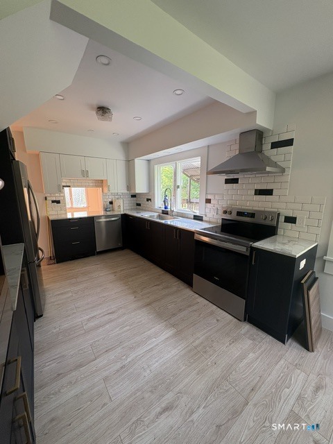 33 Flanders Road Bethlehem, CT 06751 - Photo 11 of 18 a kitchen with granite countertop a stove and cabinets
