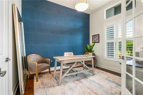 a work room with furniture and a window