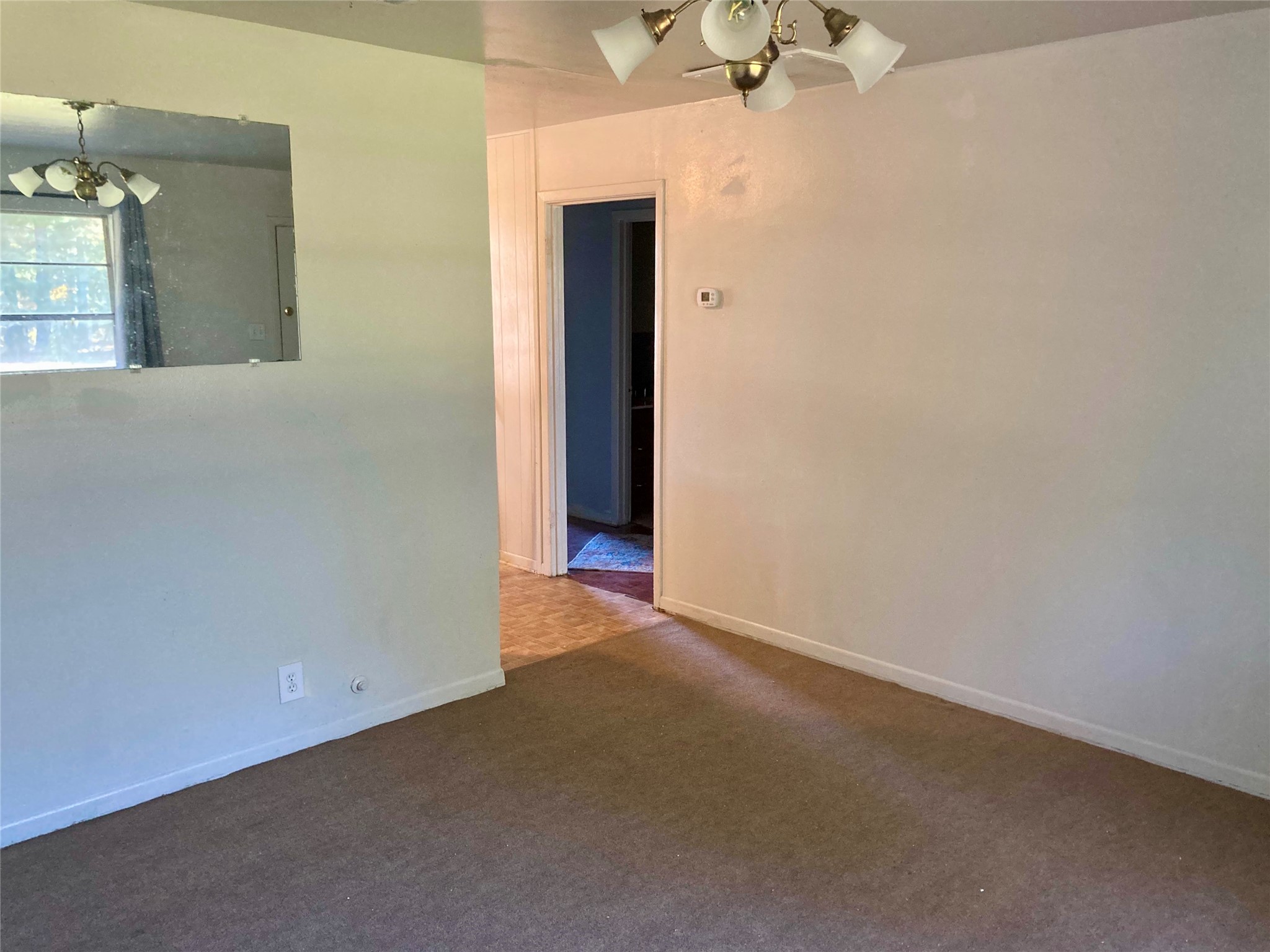 143 Moffett Springs Road, Unit A Huntsville, TX 77320 - Photo 6 of 16 a view of an empty room with a mirror