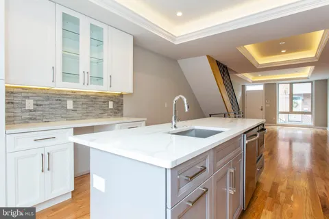 a kitchen with a sink and a window