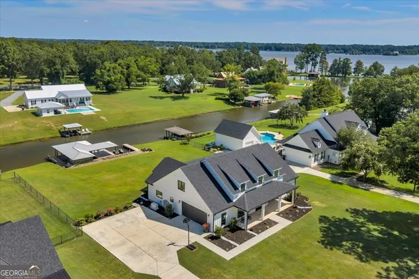 an aerial view of a house with outdoor space
