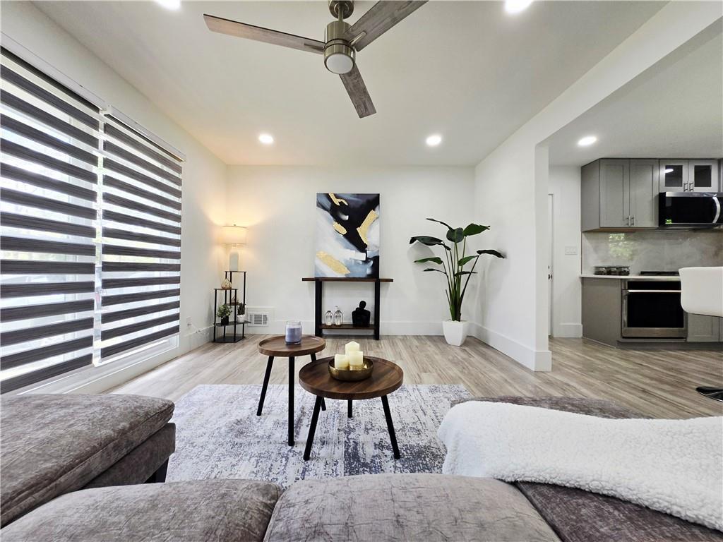 2400 Glenrock Drive Decatur, GA 30032 - Photo 14 of 39 a living room with furniture and wooden floor