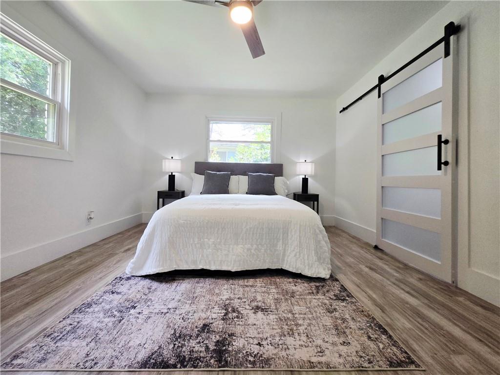 2400 Glenrock Drive Decatur, GA 30032 - Photo 16 of 39 a spacious bedroom with a bed and a window