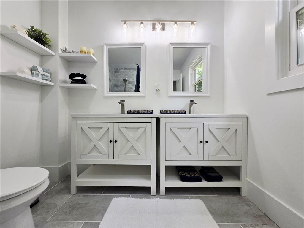 2400 Glenrock Drive Decatur, GA 30032 - Photo 20 of 39 a bathroom with a sink and a mirror