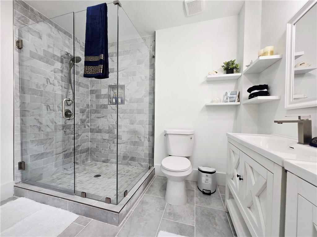 2400 Glenrock Drive Decatur, GA 30032 - Photo 21 of 39 a bathroom with a shower toilet and sink