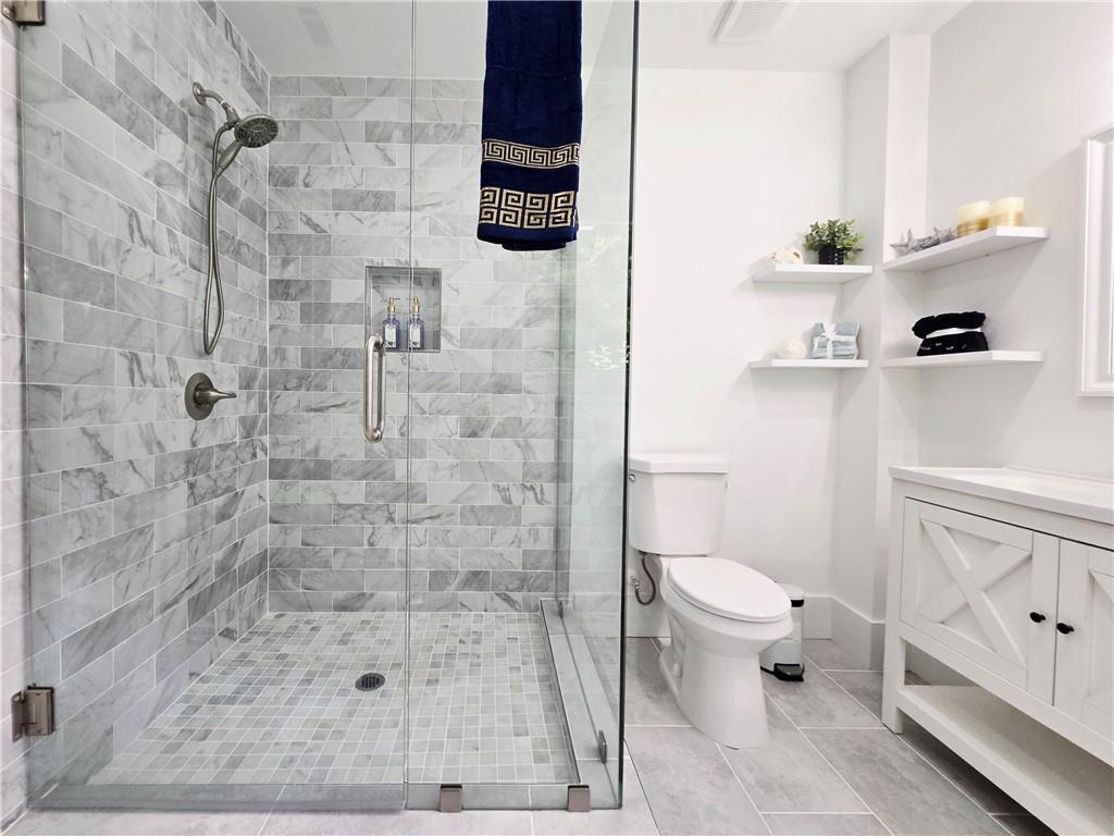 2400 Glenrock Drive Decatur, GA 30032 - Photo 22 of 39 a bathroom with a toilet and a shower