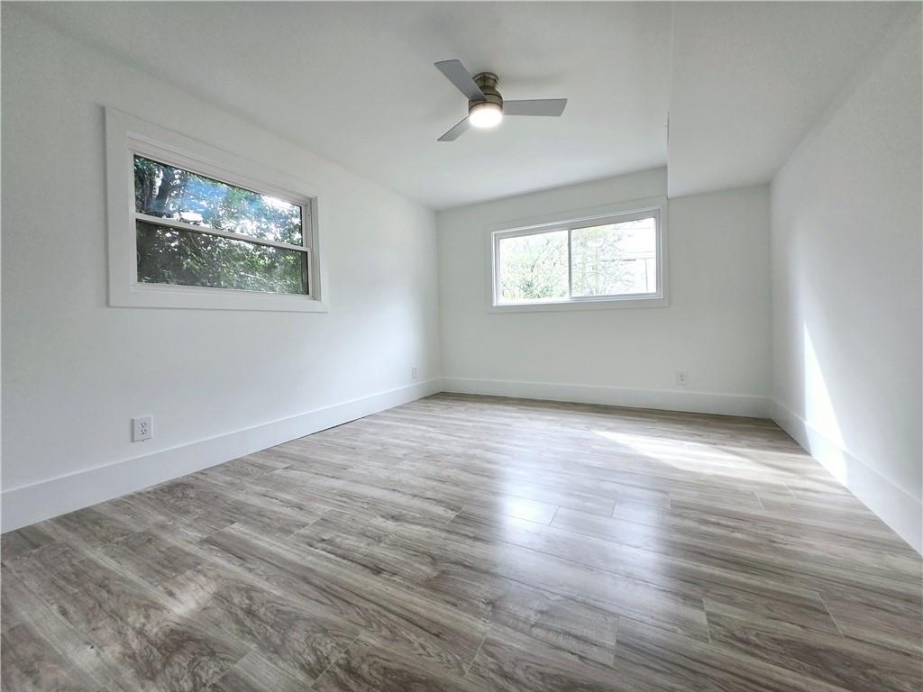 2400 Glenrock Drive Decatur, GA 30032 - Photo 28 of 39 wooden floor in an empty room with a window
