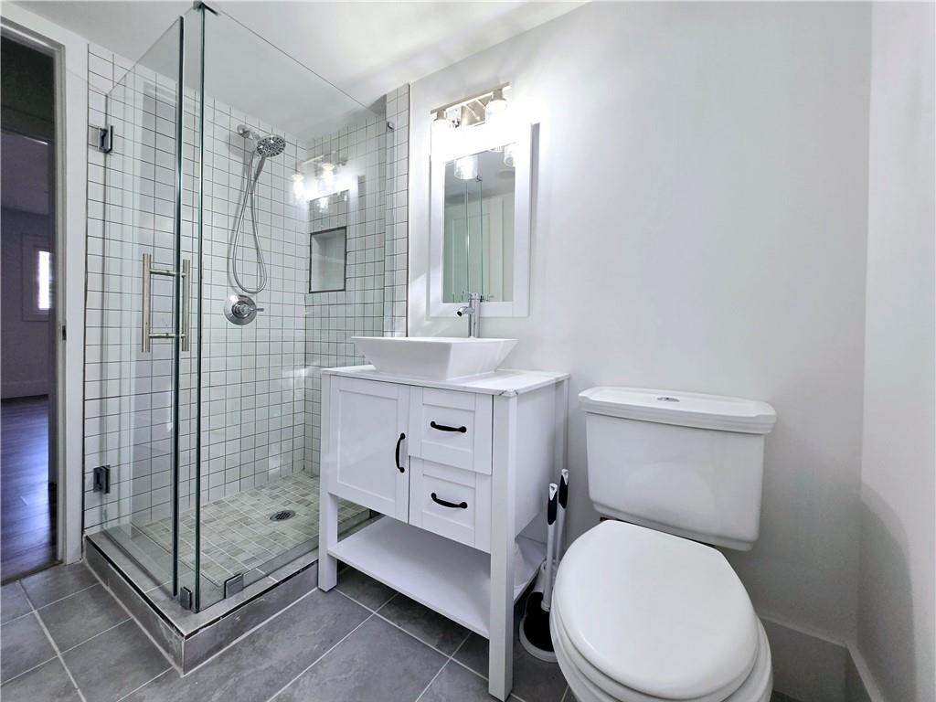 2400 Glenrock Drive Decatur, GA 30032 - Photo 33 of 39 a bathroom with a sink a toilet and shower