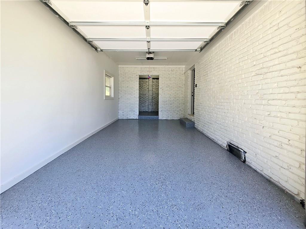 2400 Glenrock Drive Decatur, GA 30032 - Photo 37 of 39 an empty room with chandelier fan and windows