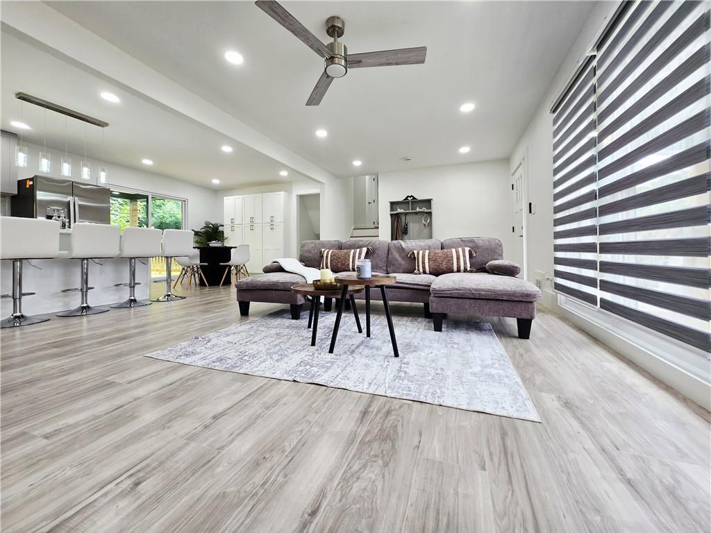 2400 Glenrock Drive Decatur, GA 30032 - Photo 6 of 39 a living room with furniture and a wooden floor