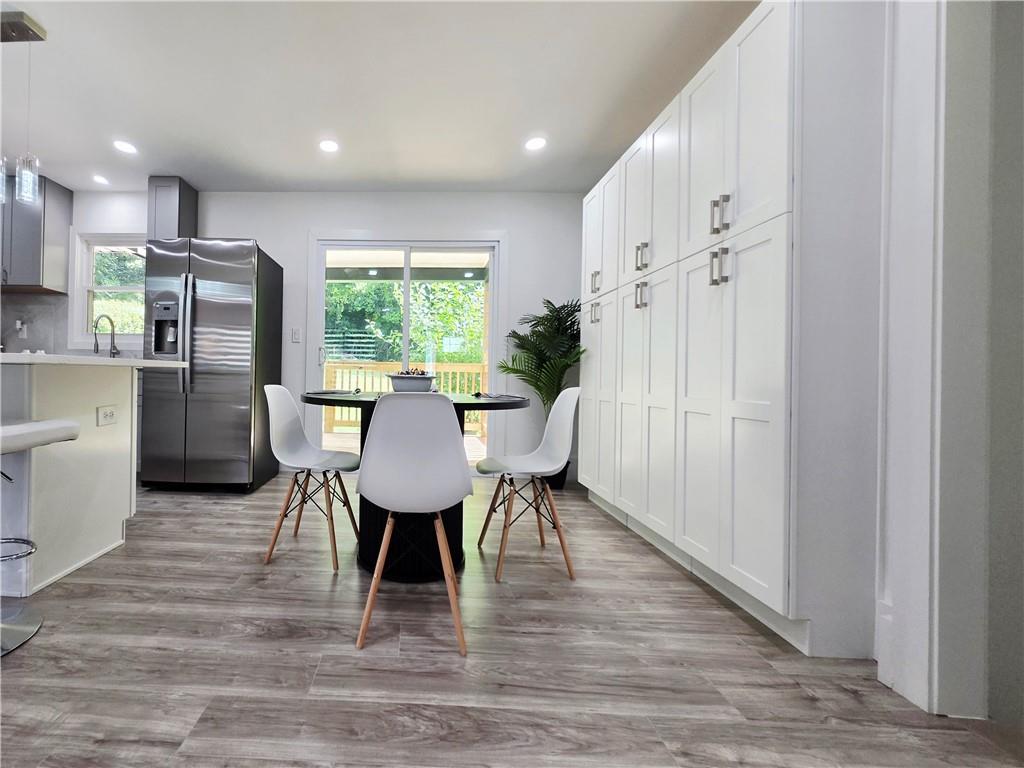 2400 Glenrock Drive Decatur, GA 30032 - Photo 9 of 39 a view of a dining room with furniture window and wooden floor