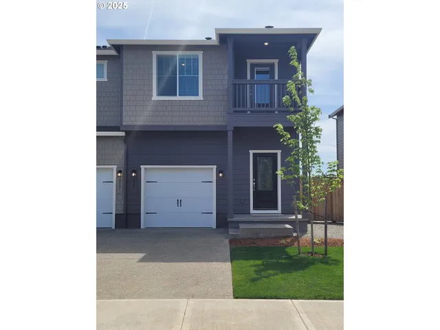 a view of a house with a small garden