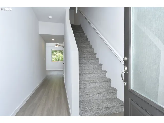 a view of entryway with wooden floor