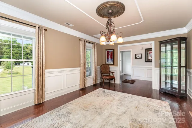 a very nice looking room with a large window and furniture