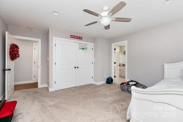 a view of a livingroom with a couch and a ceiling fan