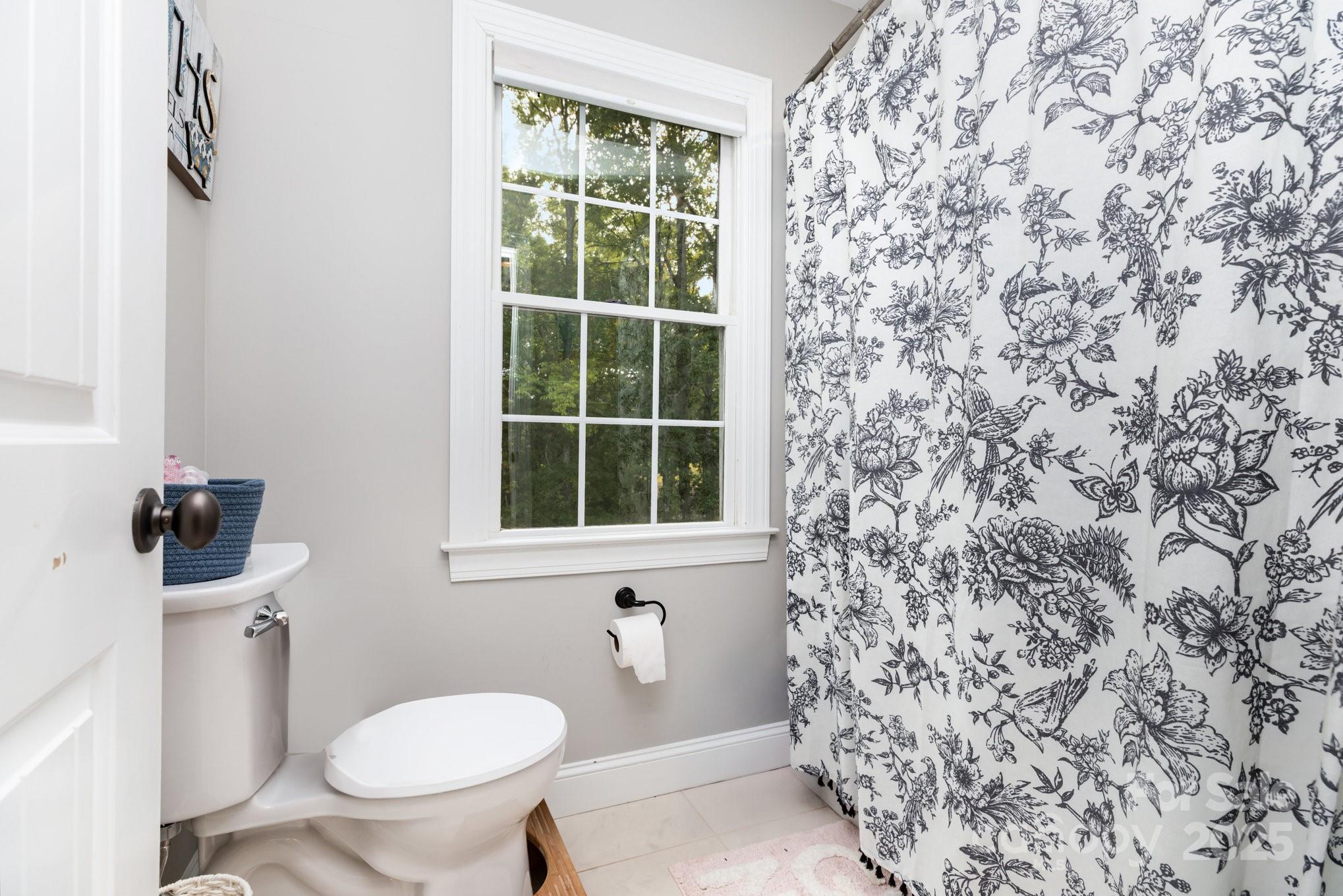 3351 Beulah Church Road Matthews, NC 28104 - Photo 20 of 33 a bathroom with a toilet and a sink