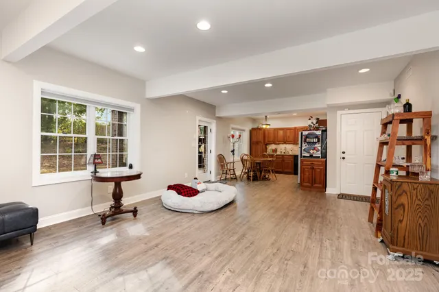 a view of a livingroom with workspace and a window