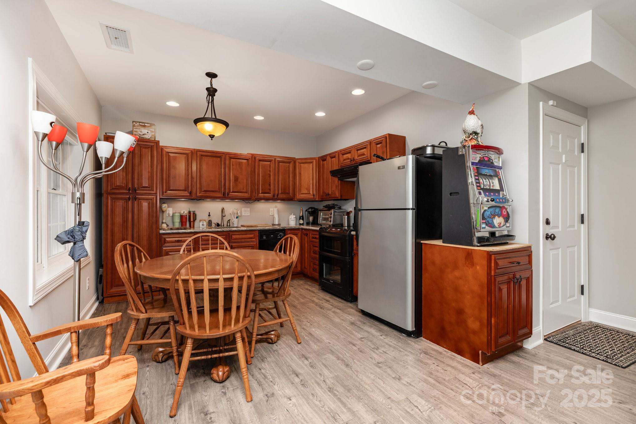 3351 Beulah Church Road Matthews, NC 28104 - Photo 26 of 33 a kitchen with stainless steel appliances granite countertop a refrigerator and a sink