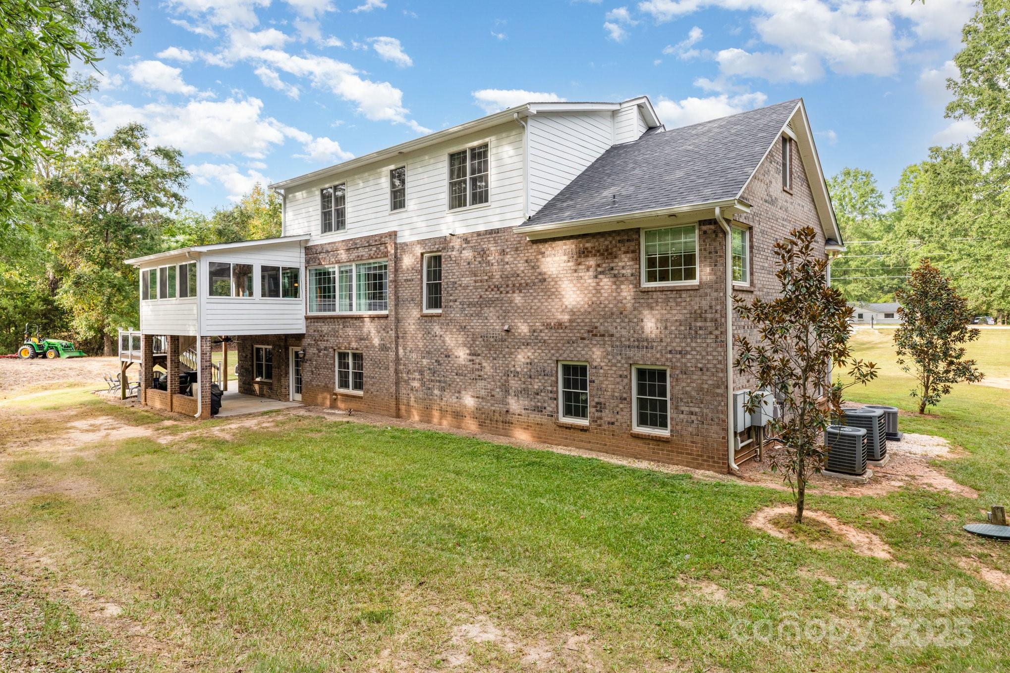 3351 Beulah Church Road Matthews, NC 28104 - Photo 33 of 33 a view of a house with a yard and sitting area