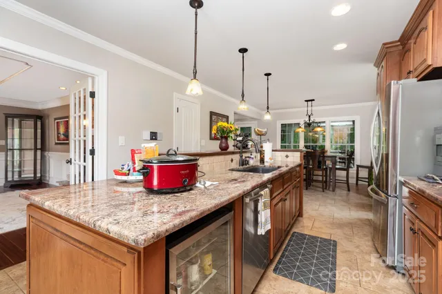 a kitchen with sink cabinets and appliances