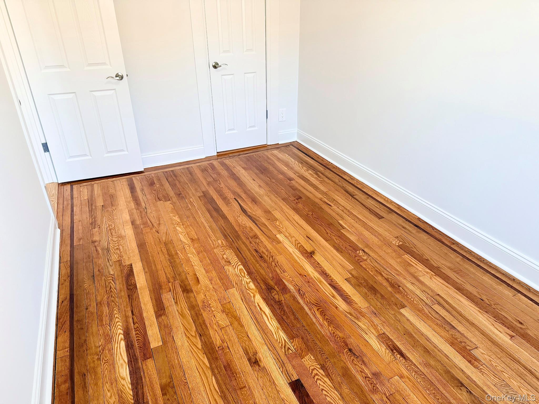 47-48 43rd Street, Unit 2F Queens, NY 11377 - Photo 14 of 29 a view of backyard with wooden floor