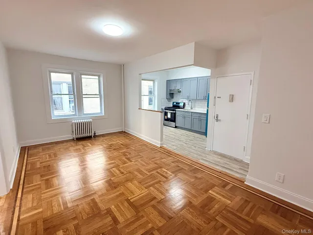 a view of a kitchen with a sink and cabinets