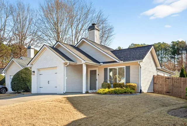 a view of garage and yard