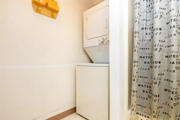 a bathroom with a shower and a sink
