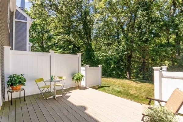 a view of a backyard with a sitting area